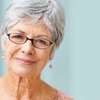 Closeup of a beautiful retired senior woman smiling