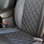 white 2019 jeep wrangler unlimited jl Custom pattern black leather front seats with white stitching up close