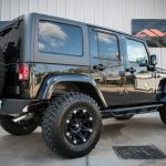 black 2016 jeep wrangler unlimited sahara jk right rear angle