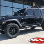 Black JL Jeep 20x10 2.5″ lift Ballistic 961 "Guillotine" wheels gloss black milled accents 35″ tires snorkel rack lights