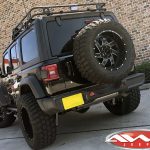Black JL Jeep 20x10 2.5″ lift Ballistic 961 "Guillotine" wheels gloss black milled accents 35″ tires snorkel rack lights