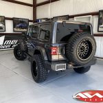 2020 Gray JL Jeep 2.5" Rough Country Lift 20" Ballistic Off-road Machete Wheels Gloss Black 35x12.50R20 tires left rear angle