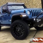 2019 JL Jeep 2.5" lift 20x10 Ballistic Tank wheels 35" tires DV8 bumper 50" light bar right front angle