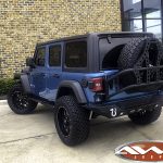 2019 JL Jeep 2.5" lift 20x10 Ballistic Tank wheels 35" tires DV8 bumper 50" light bar left rear angle