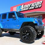 Blue JK Jeep 4" Rough Country lift fox remote reservoir shocks 22x12 fuel offroad assault wheel 37" nitto mud grappler tires