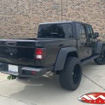 2020 Black Jeep Gladiator 2.5″ Rough Country lift 22×12 Hostile H114 "Fury" wheels asphalt 35″ tires left rear angle