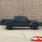 2020 Black Jeep Gladiator 2.5″ Rough Country lift 22×12 Hostile H114 "Fury" wheels asphalt 35″ tires side view