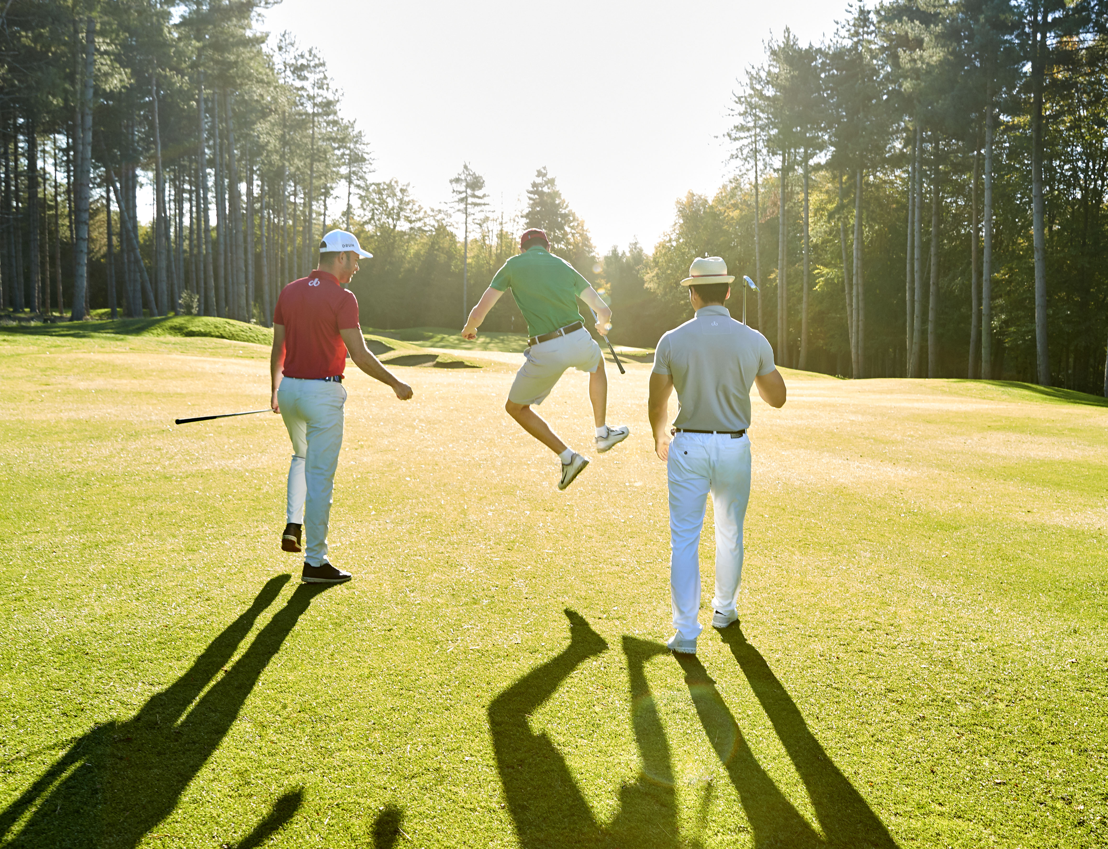 three man golfing together