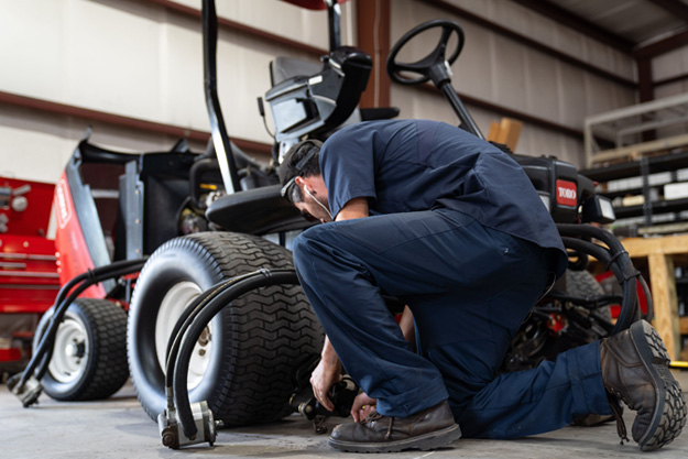 working on mower