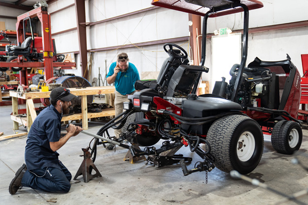 working on mower