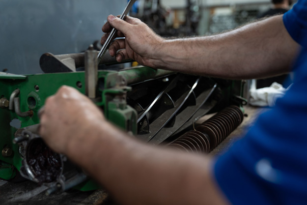 working on mower blades