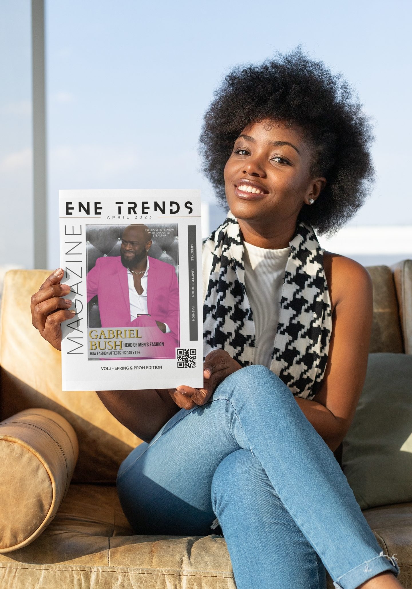 Model with ENE trends Magazine in hand smiling pretty