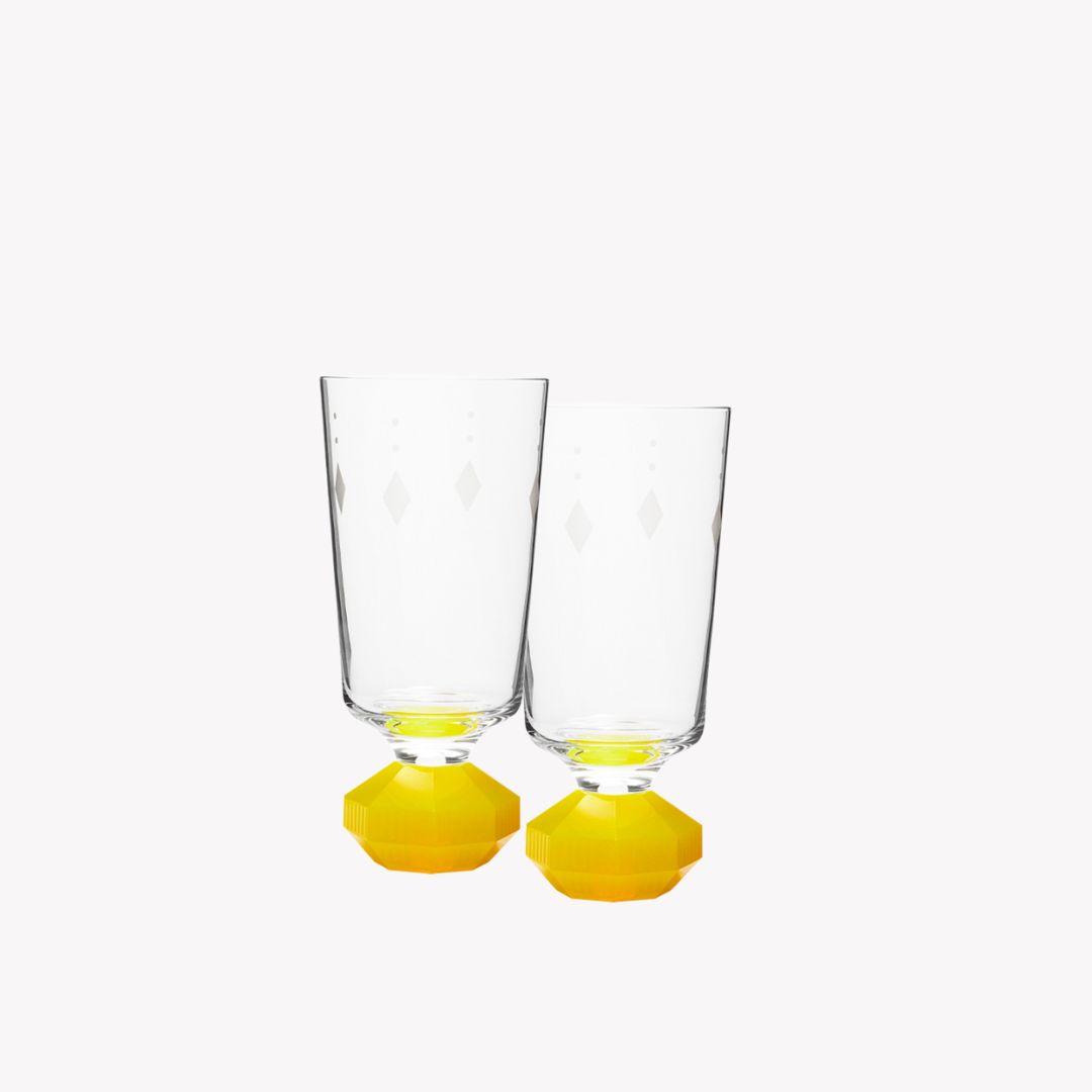 Add a touch of luxury to your drink with these Reflections Copenhagen glasses. This set includes two glasses in different colors that are perfect for any occasion.