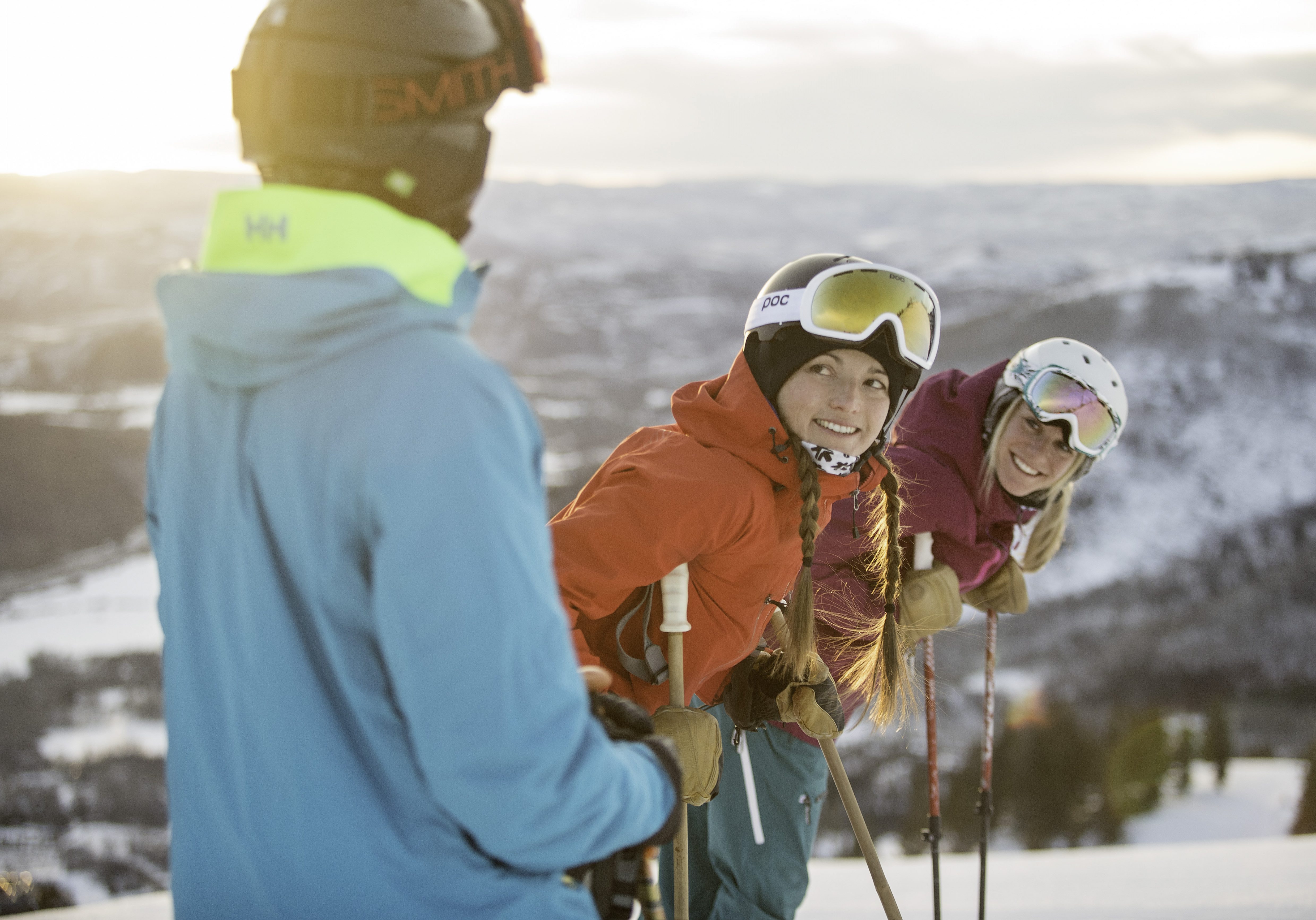 Friends ski together under the sun in Park City, UT.