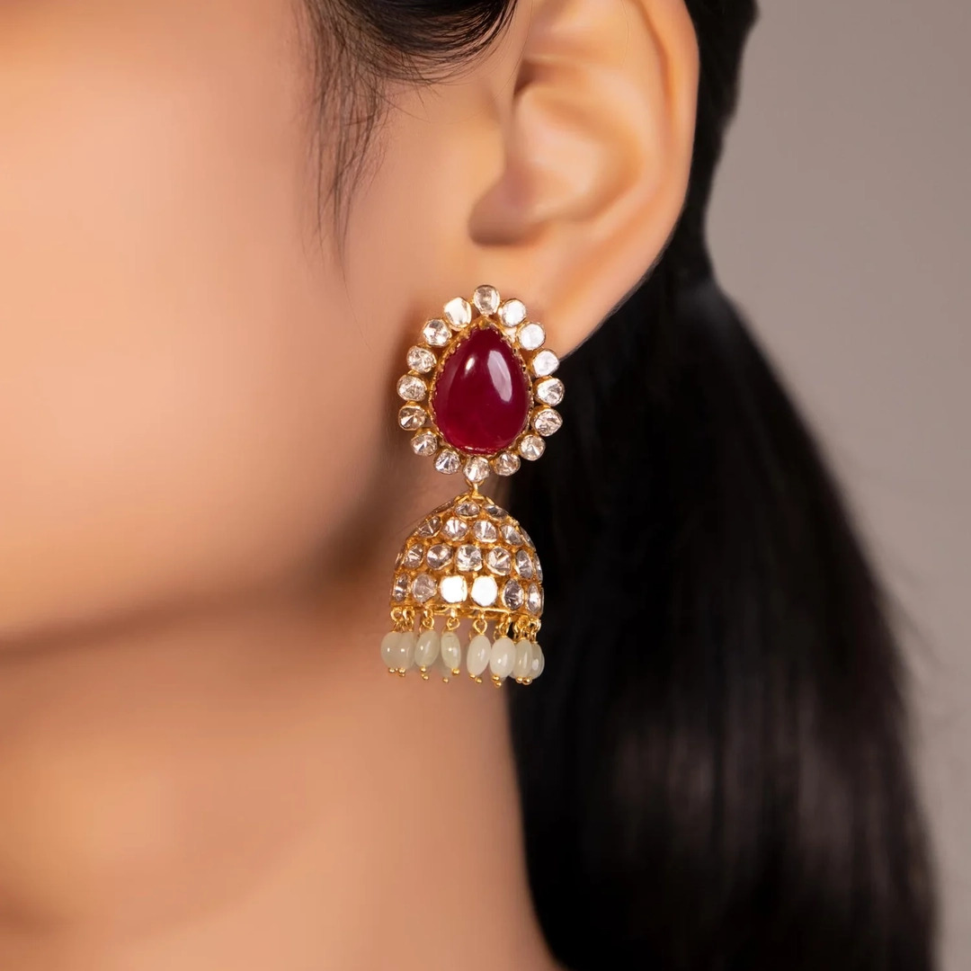 gold jhumka earrings for peach pink dress