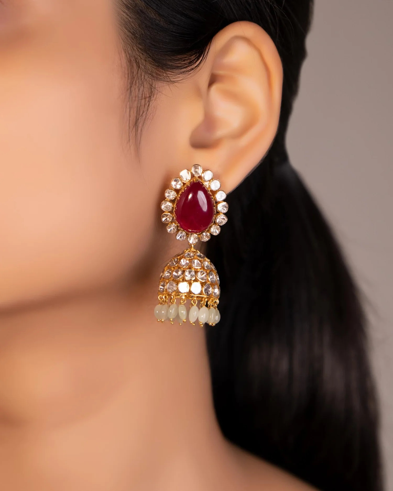 gold jhumka earrings for peach pink dress