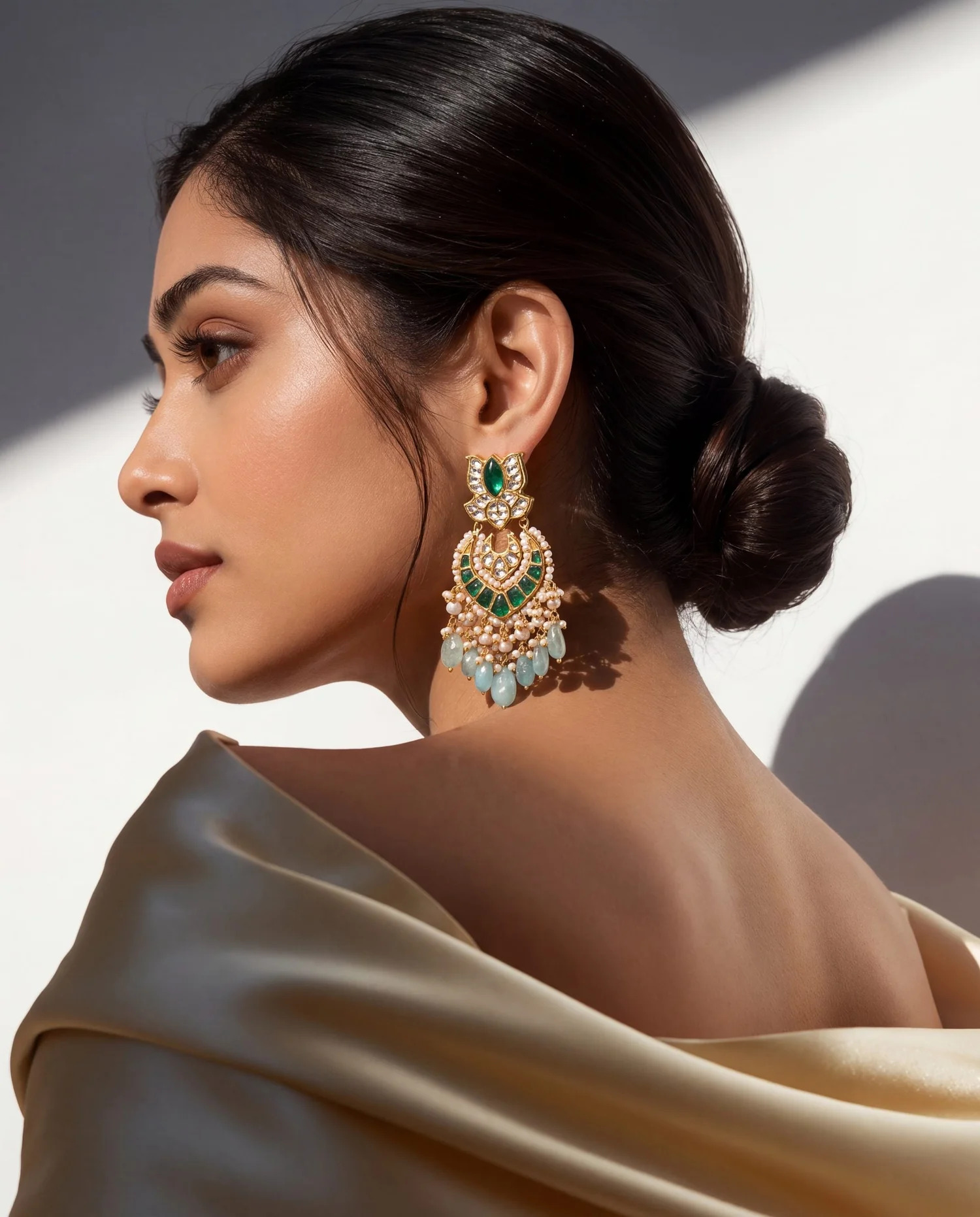 green jewellery for off-white dress