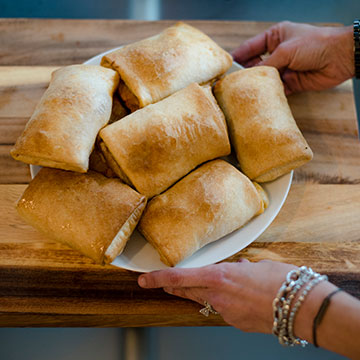 Jen-serving-plate-of-puffs-1